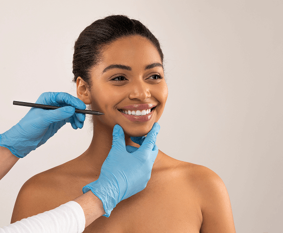 Happy young black woman getting ready before plastic surgery session