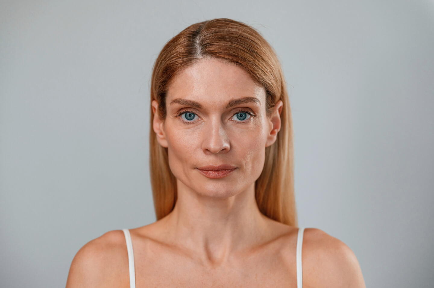 Portrait of woman that is standing against background