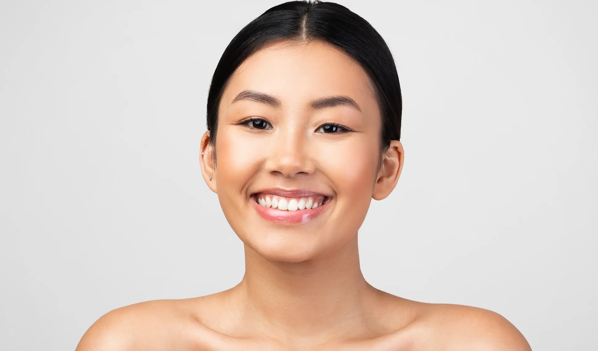 Pretty Korean Young Woman Smiling Posing Shirtless Over Gray Background