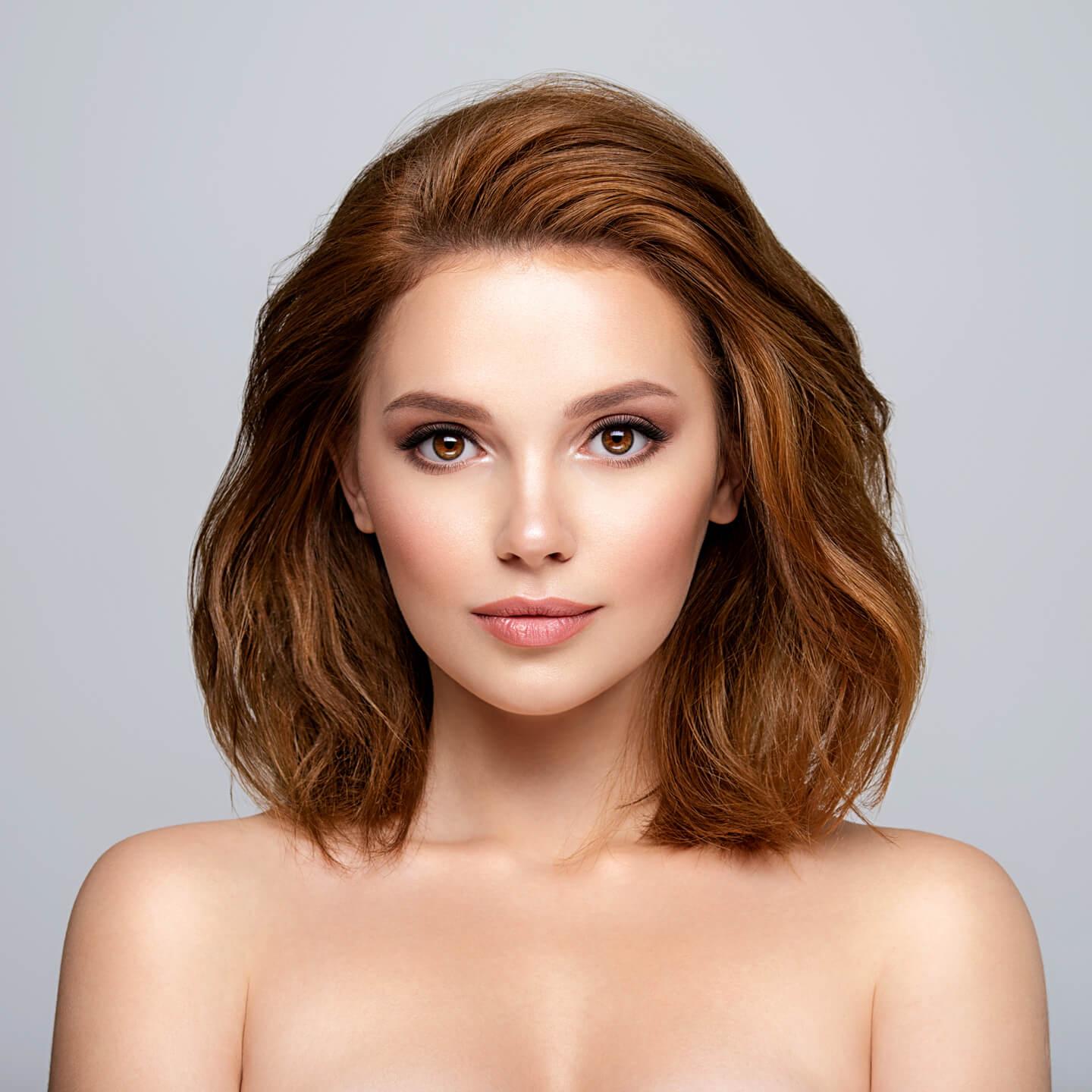 Portrait of a beautiful woman with a long brown hair