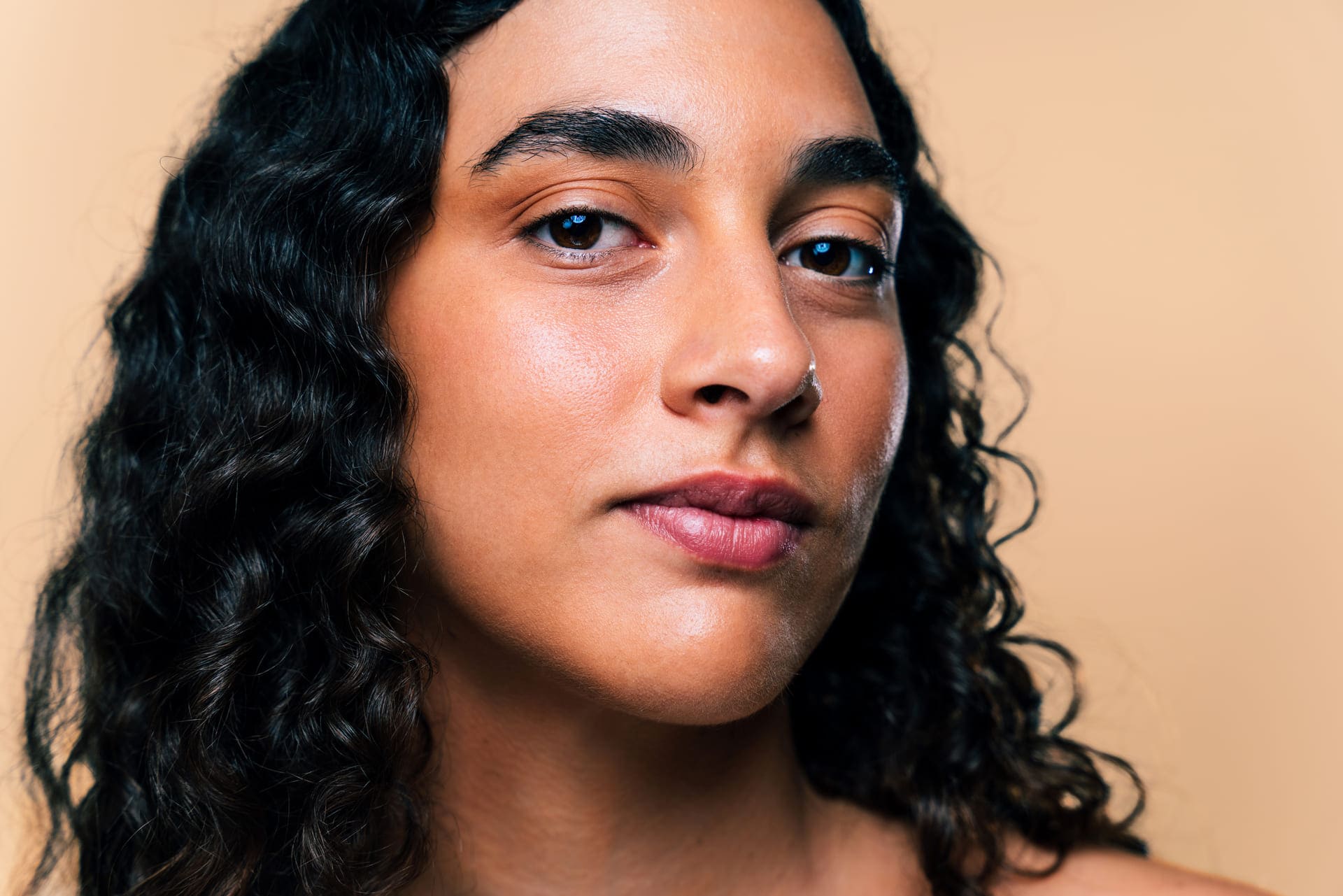 Beauty studio portrait of beautiful hispanic woman with diastema